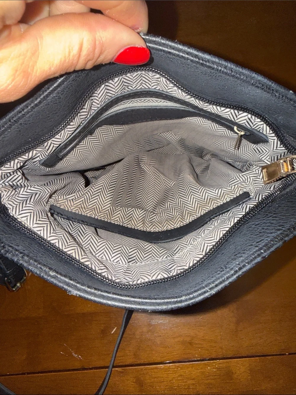 Classic Black Leather Crossbody Bag with Gold Zippers
